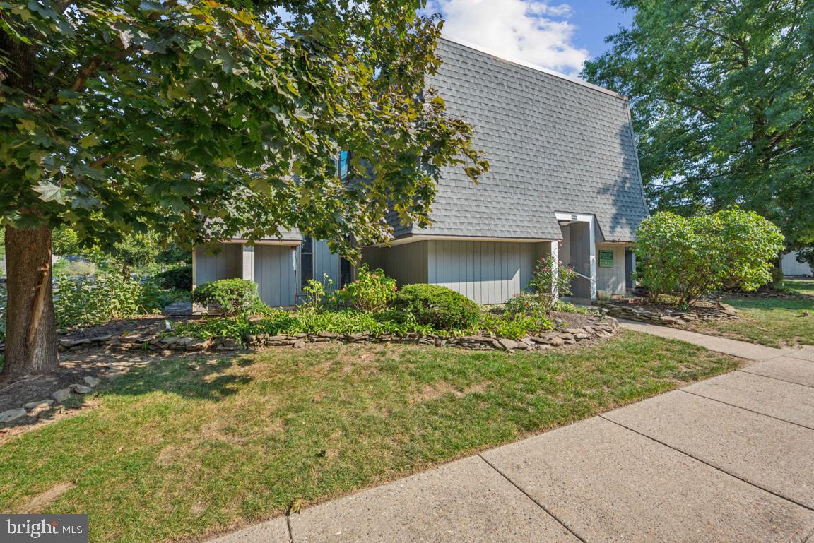 25 Church Road, Unit 150 Maple Shade, NJ 08052 - Photo 1 of 22 a front view of a house with a yard and trees
