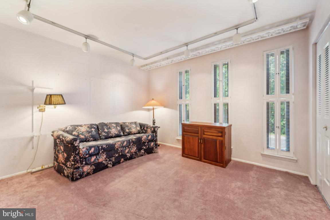 25 Church Road, Unit 150 Maple Shade, NJ 08052 - Photo 17 of 22 a bed room with furniture and a window