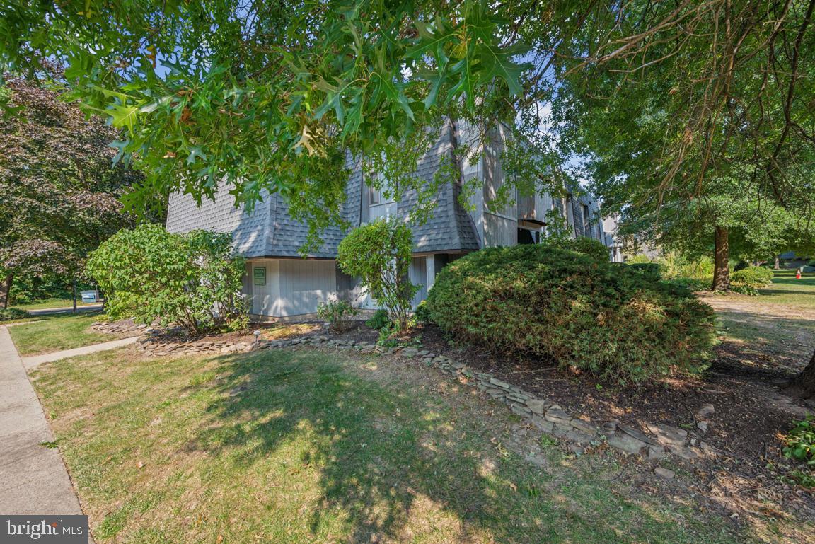 25 Church Road, Unit 150 Maple Shade, NJ 08052 - Photo 2 of 22 a view of a backyard with large trees