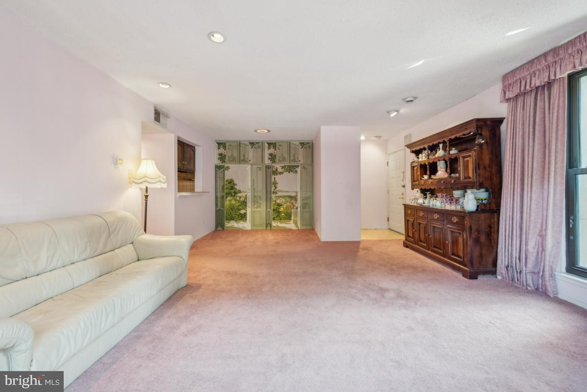 25 Church Road, Unit 150 Maple Shade, NJ 08052 - Photo 7 of 22 a living room with furniture and a refrigerator