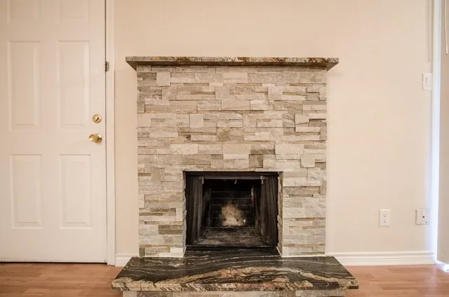 a stone house with fireplace