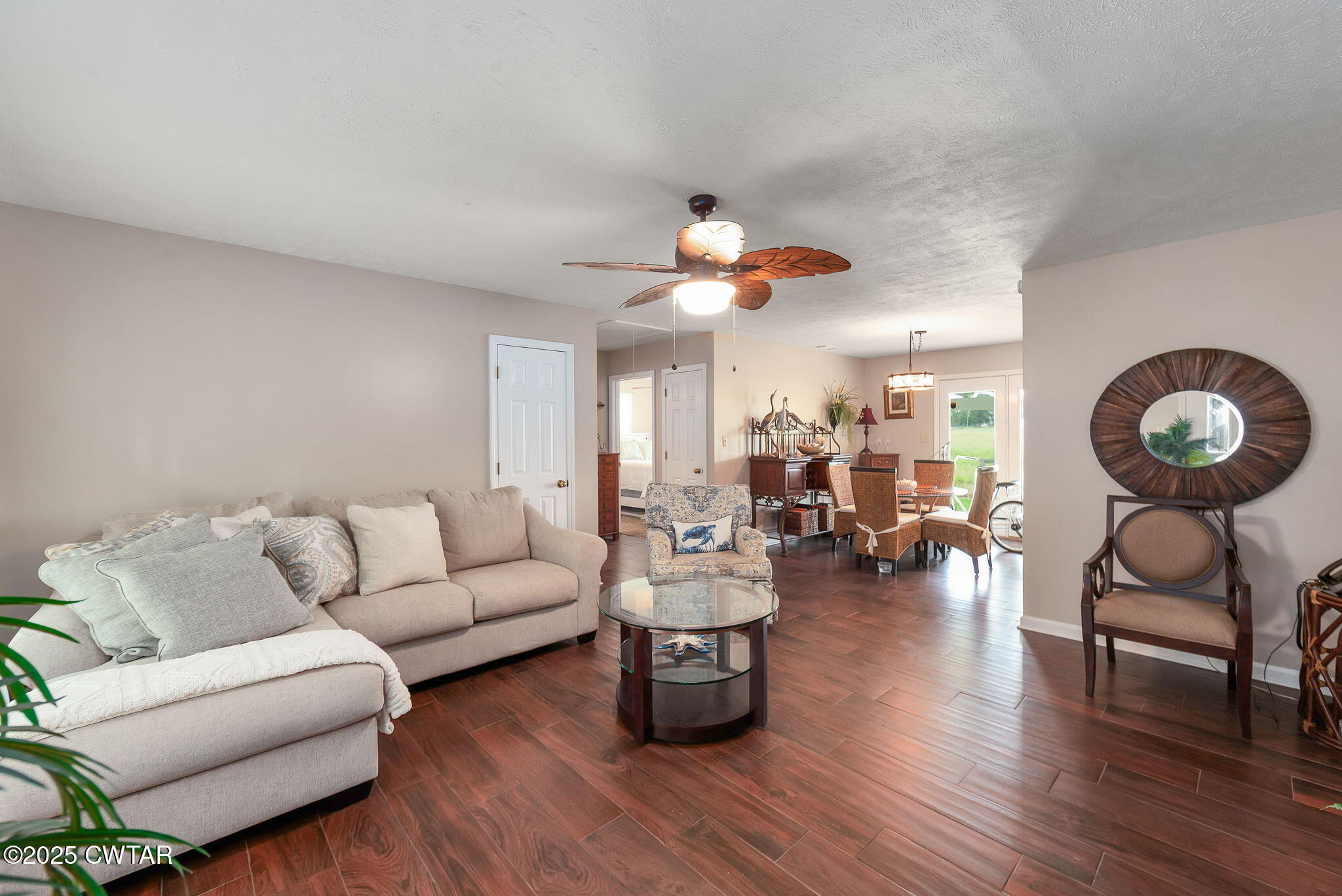 114 Falcon Cove Middleton, TN 38052 - Photo 11 of 24 a living room with furniture and wooden floor