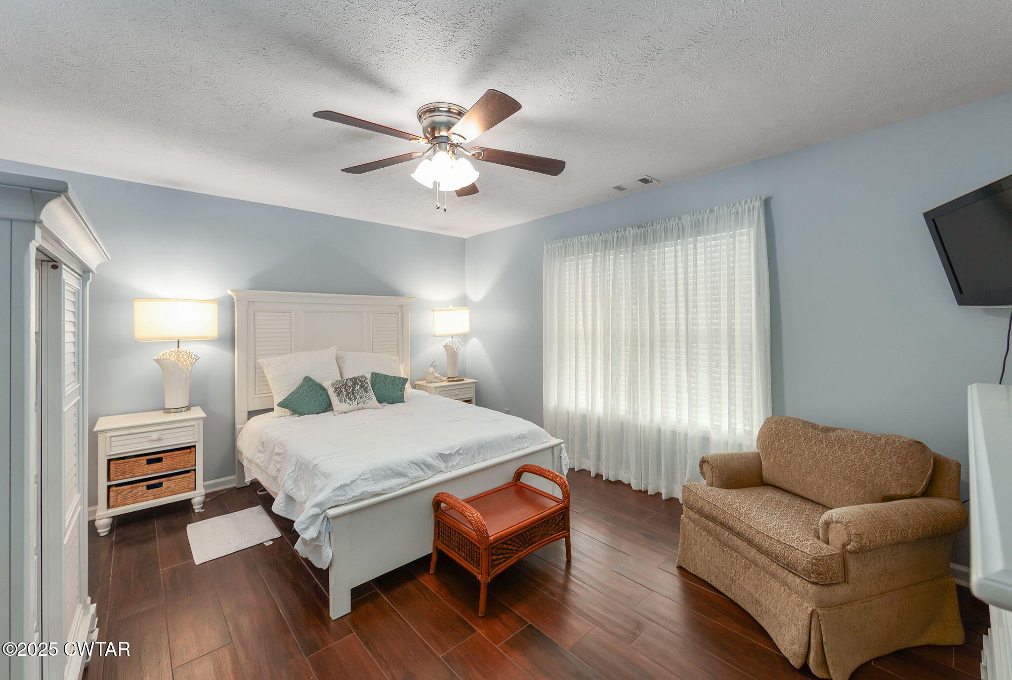 114 Falcon Cove Middleton, TN 38052 - Photo 12 of 24 a bedroom with a bed and a couch