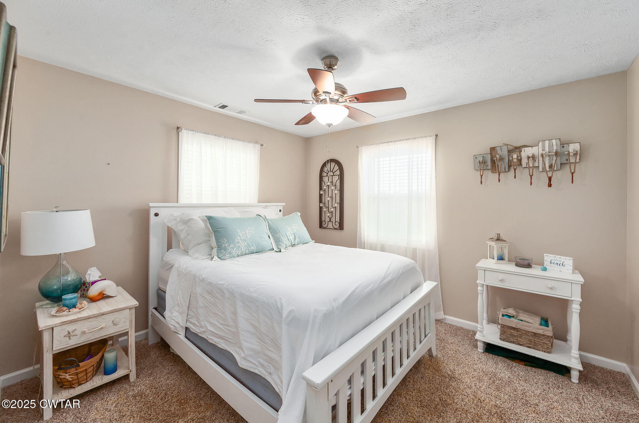 114 Falcon Cove Middleton, TN 38052 - Photo 14 of 24 a bed room with a bed and a baby bed