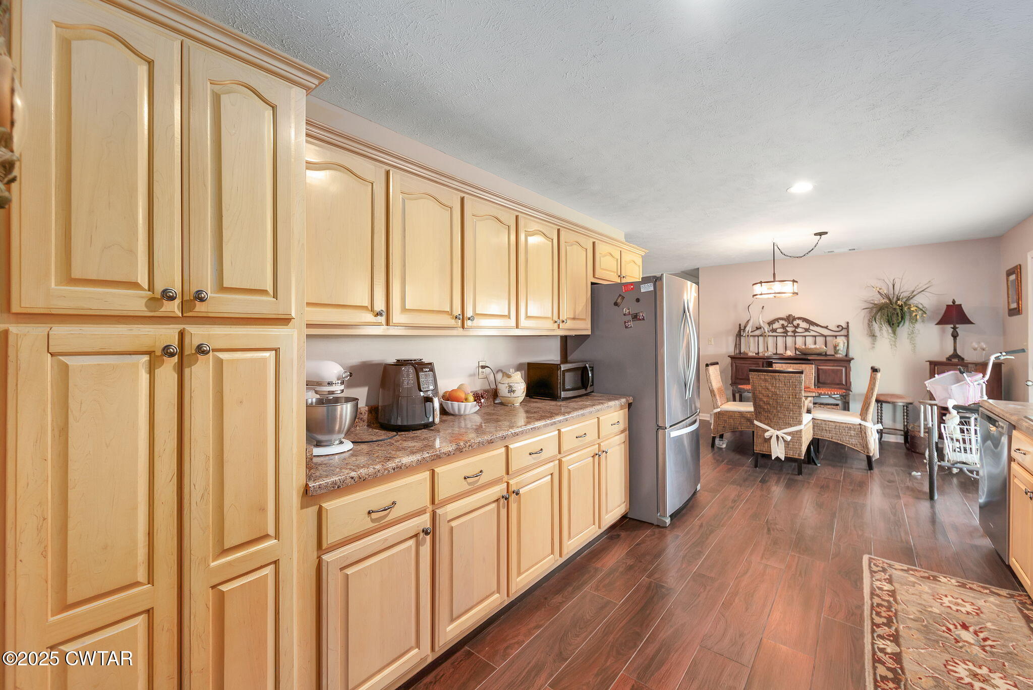 114 Falcon Cove Middleton, TN 38052 - Photo 4 of 24 a kitchen with stainless steel appliances granite countertop lots of counter top space and wooden floors