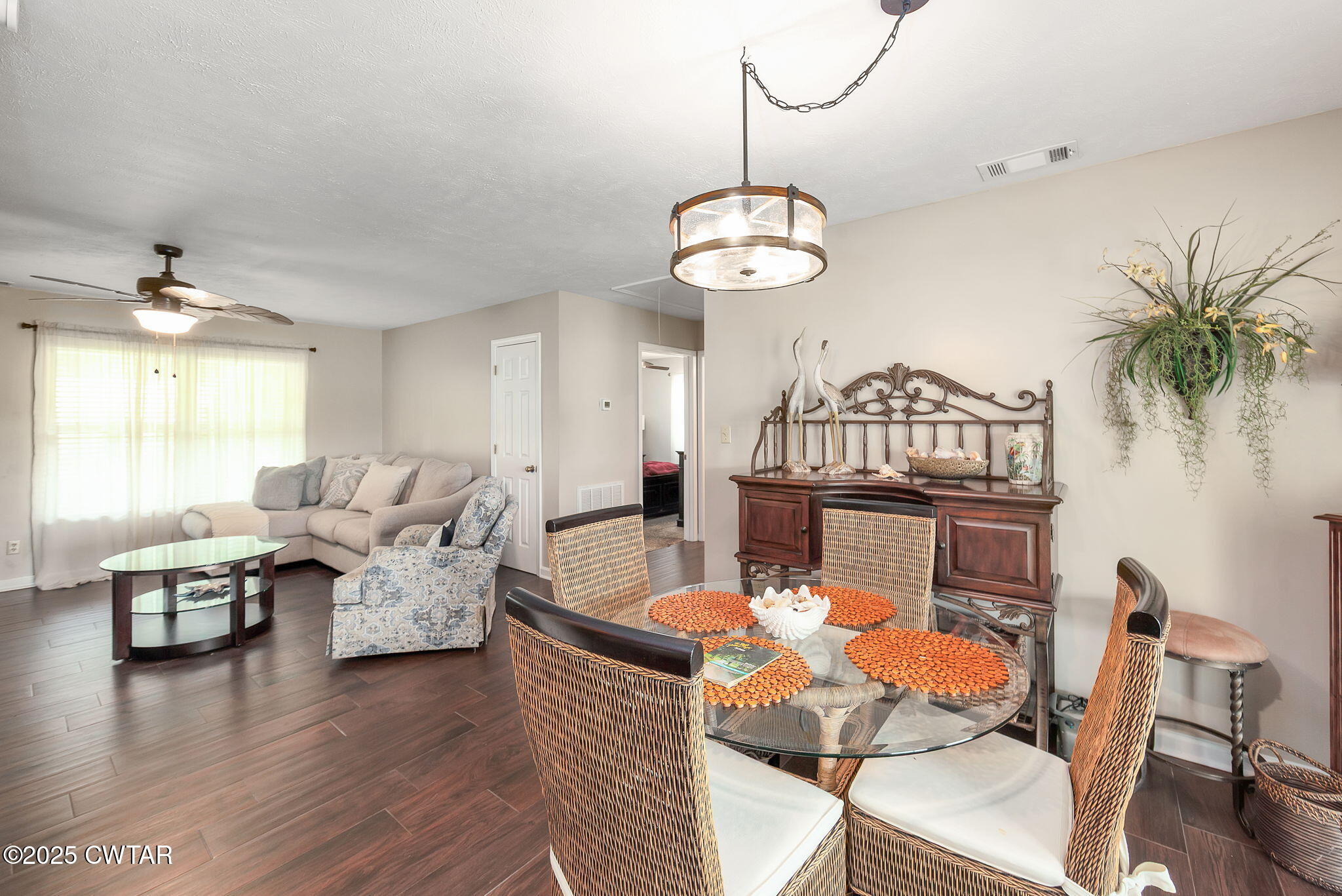114 Falcon Cove Middleton, TN 38052 - Photo 7 of 24 a view of a dining room with furniture wooden floor and chandelier