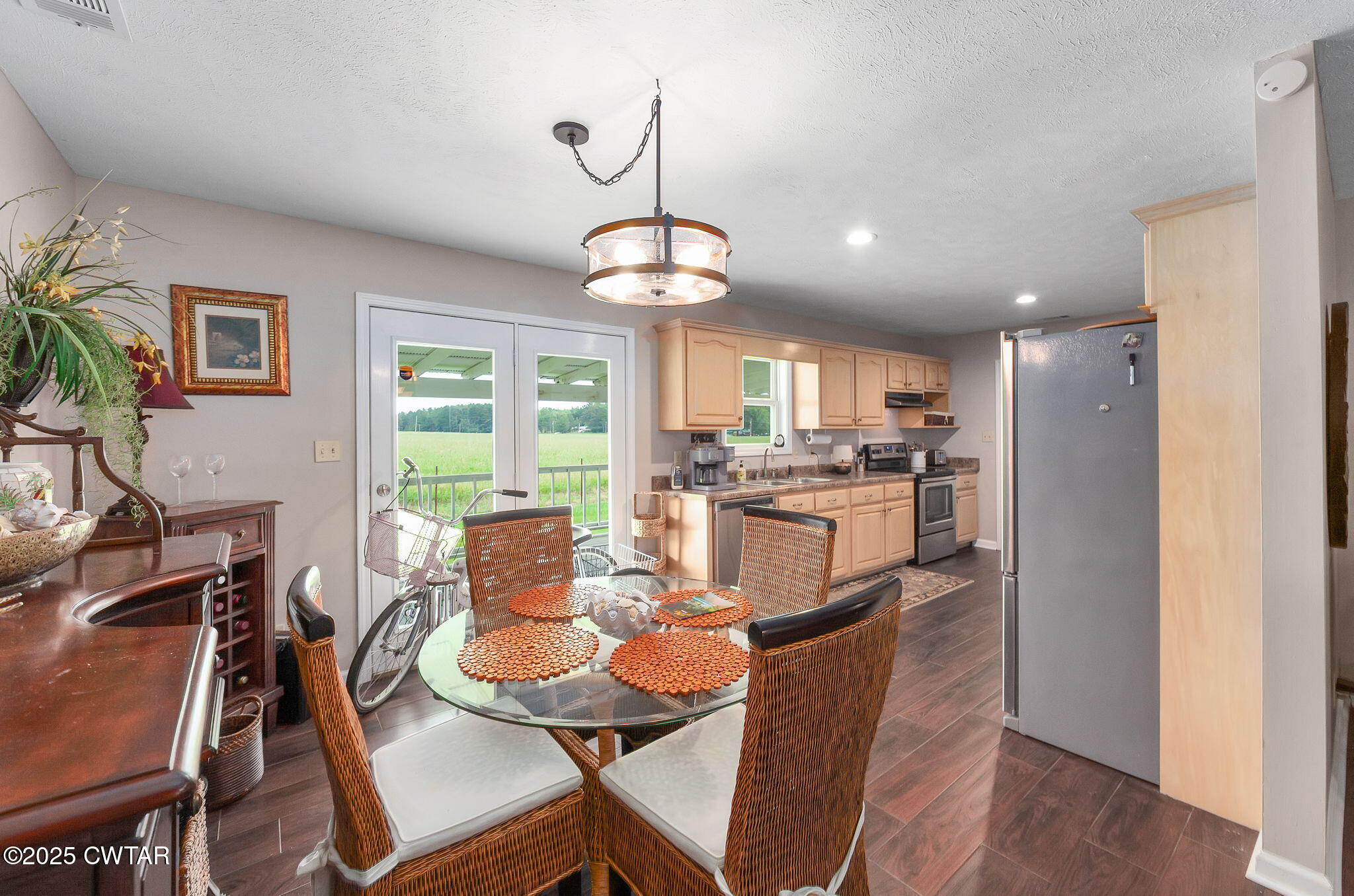 114 Falcon Cove Middleton, TN 38052 - Photo 8 of 24 a dining room with furniture a chandelier and wooden floor