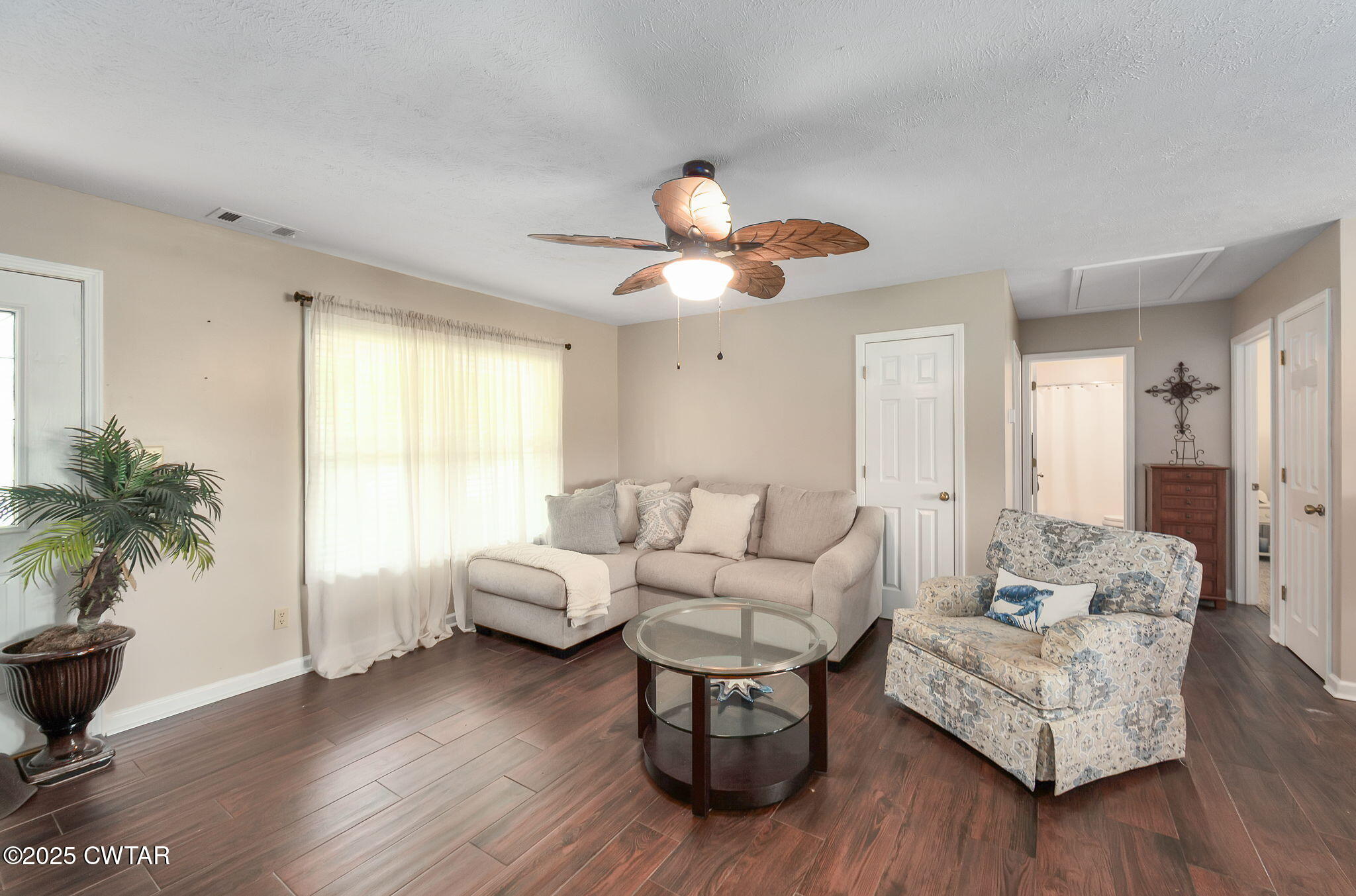 114 Falcon Cove Middleton, TN 38052 - Photo 10 of 24 a living room with furniture and a large window