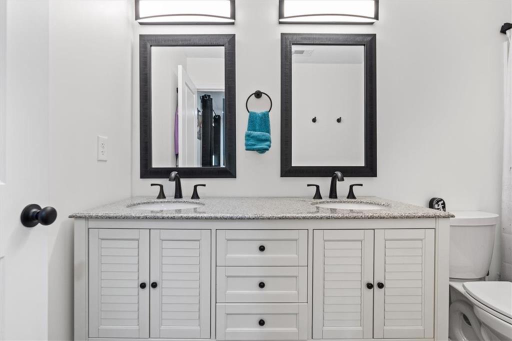 62 Dude Street Northwest Rome, GA 30165 - Photo 14 of 21 a bathroom with a granite countertop sink vanity and mirror