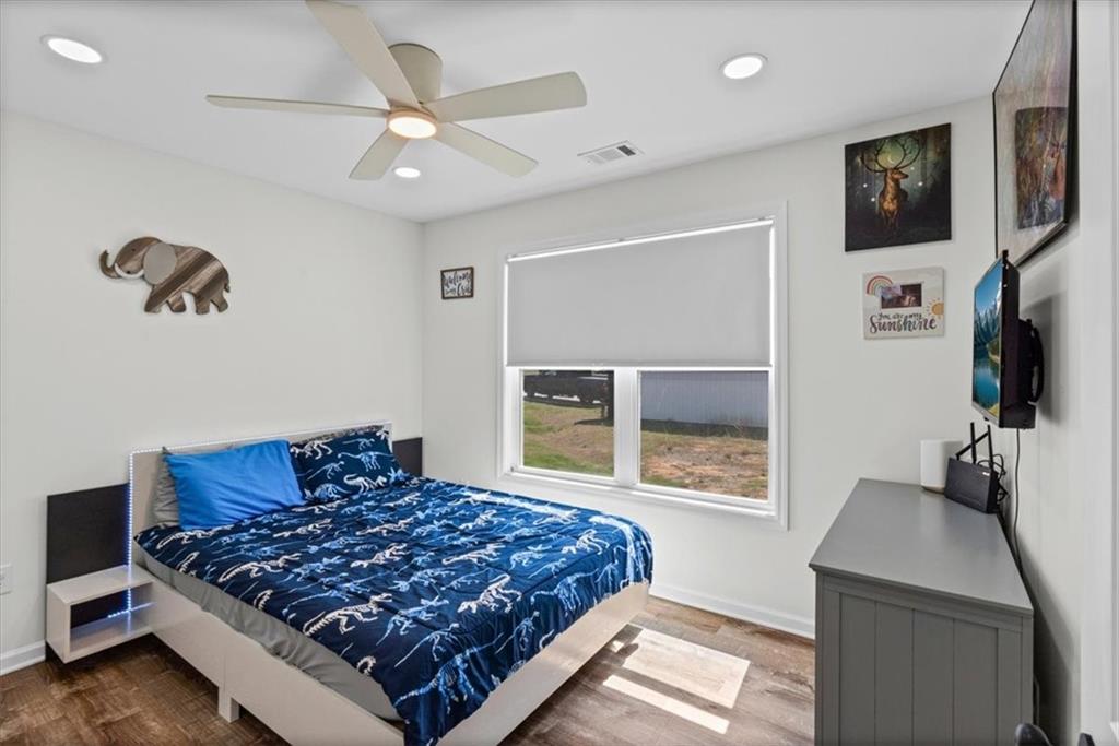 62 Dude Street Northwest Rome, GA 30165 - Photo 16 of 21 a bedroom with a bed and a flat screen tv