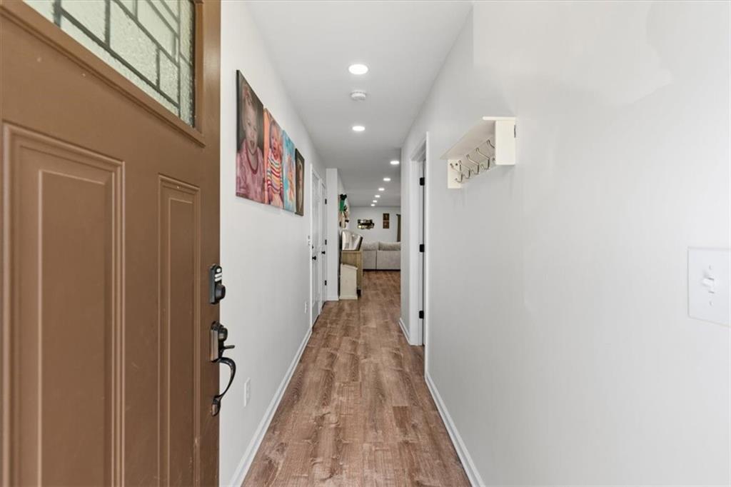 62 Dude Street Northwest Rome, GA 30165 - Photo 2 of 21 a view of a hallway with wooden floor and staircase