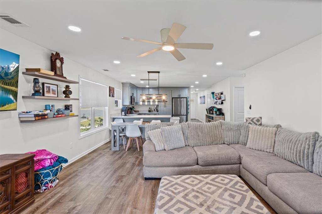 62 Dude Street Northwest Rome, GA 30165 - Photo 5 of 21 a living room with furniture kitchen view and a wooden floor