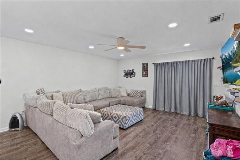 62 Dude Street Northwest Rome, GA 30165 - Photo 6 of 21 a living room with furniture and a potted plant