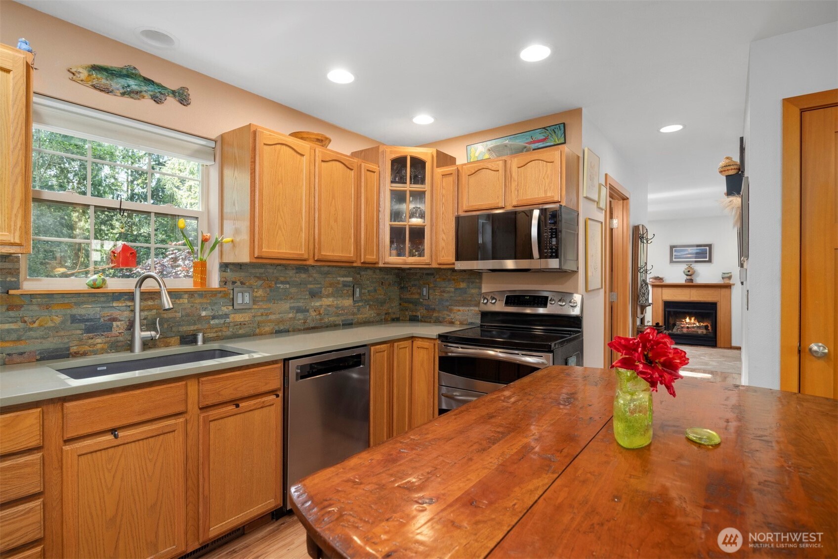 337 Sudden Valley Drive Bellingham, WA 98229 - Photo 11 of 40 a kitchen with kitchen island granite countertop a sink counter top space appliances and cabinets