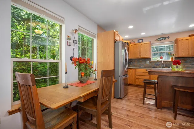 a view of a dining room with furniture window and wooden floor