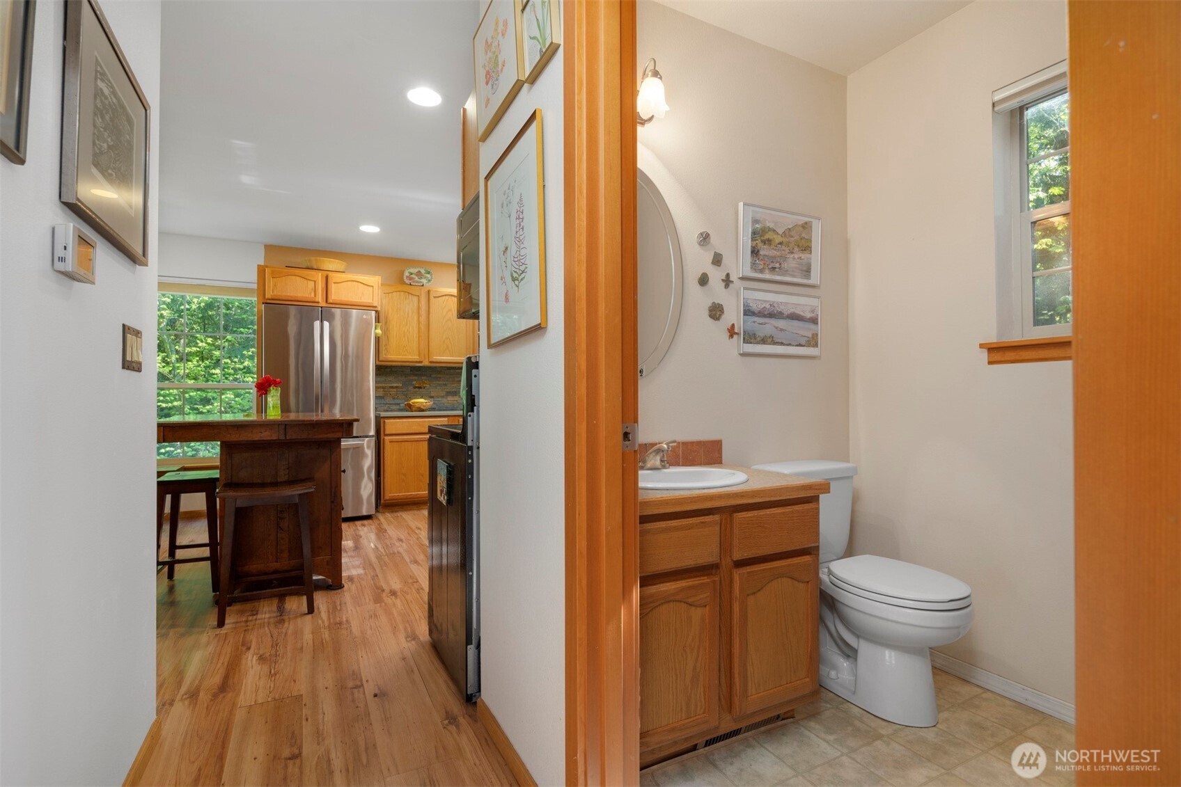 337 Sudden Valley Drive Bellingham, WA 98229 - Photo 14 of 40 a bathroom with a toilet a sink and a mirror