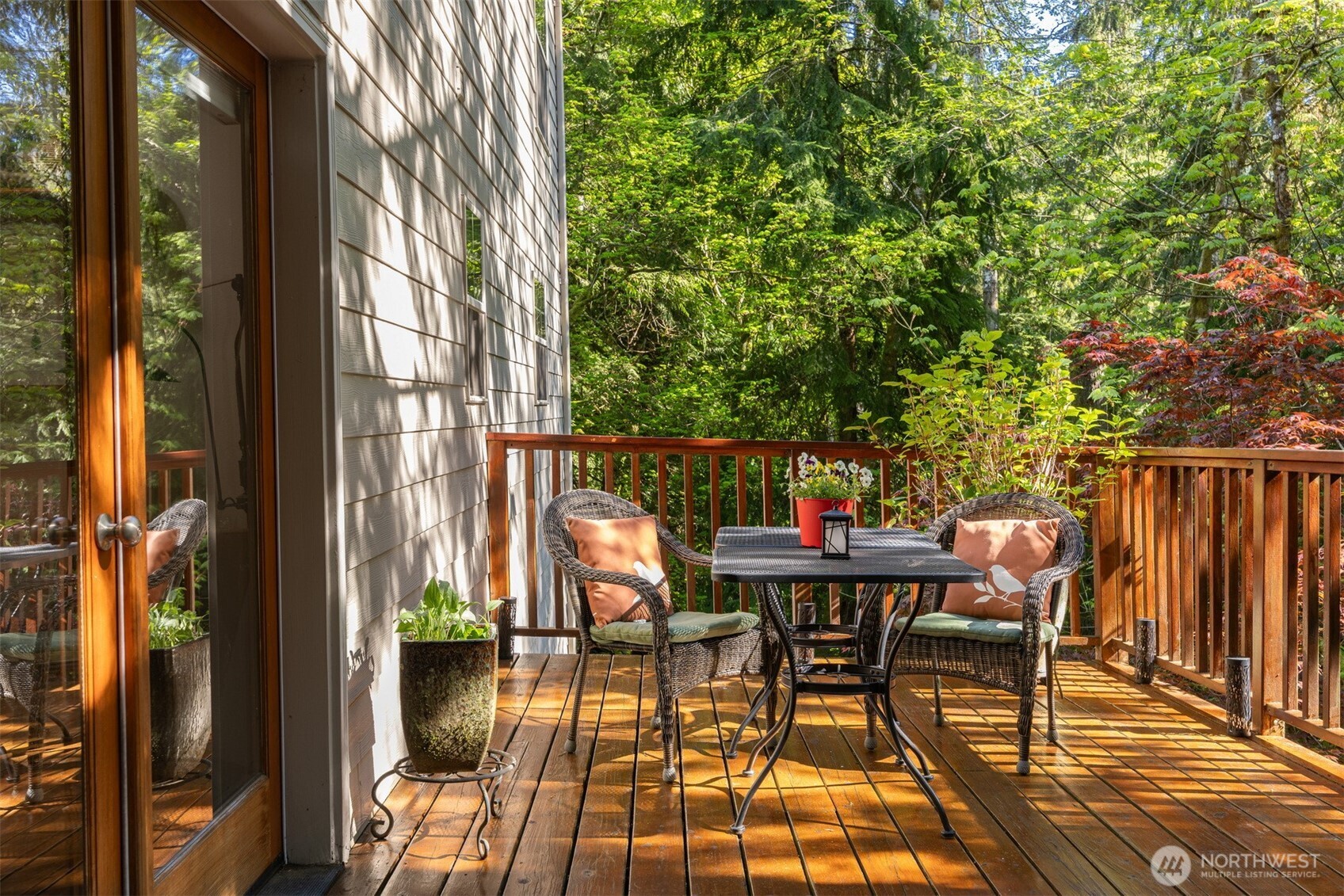 337 Sudden Valley Drive Bellingham, WA 98229 - Photo 19 of 40 a patio with table and chairs and potted plants