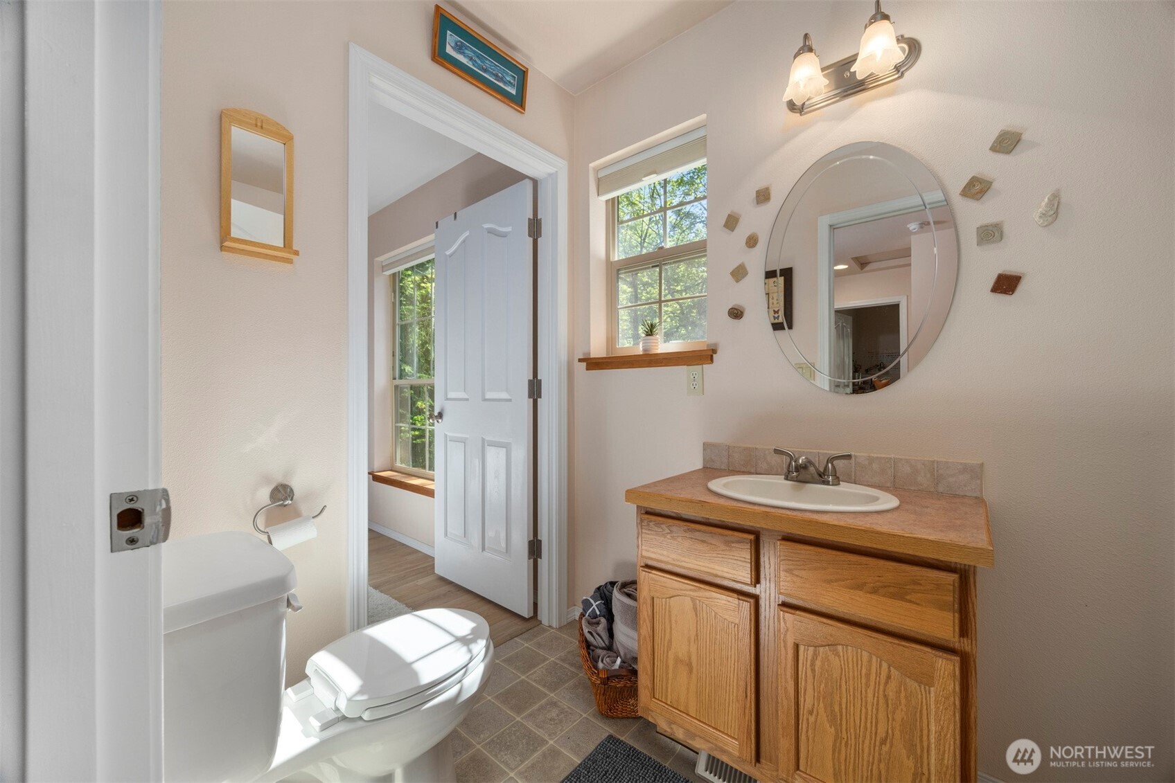 337 Sudden Valley Drive Bellingham, WA 98229 - Photo 28 of 40 a bathroom with a sink a vanity and a mirror