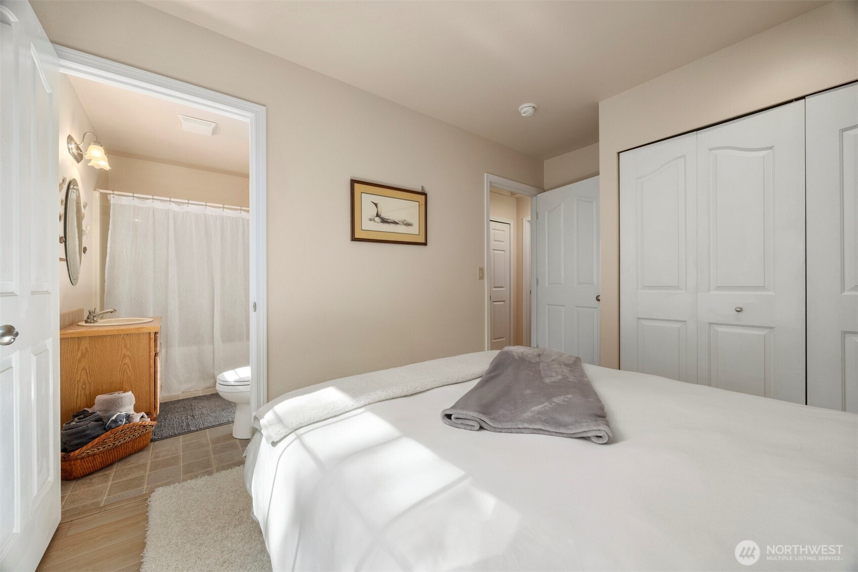 337 Sudden Valley Drive Bellingham, WA 98229 - Photo 31 of 40 a bedroom with a bed and a view of bathroom