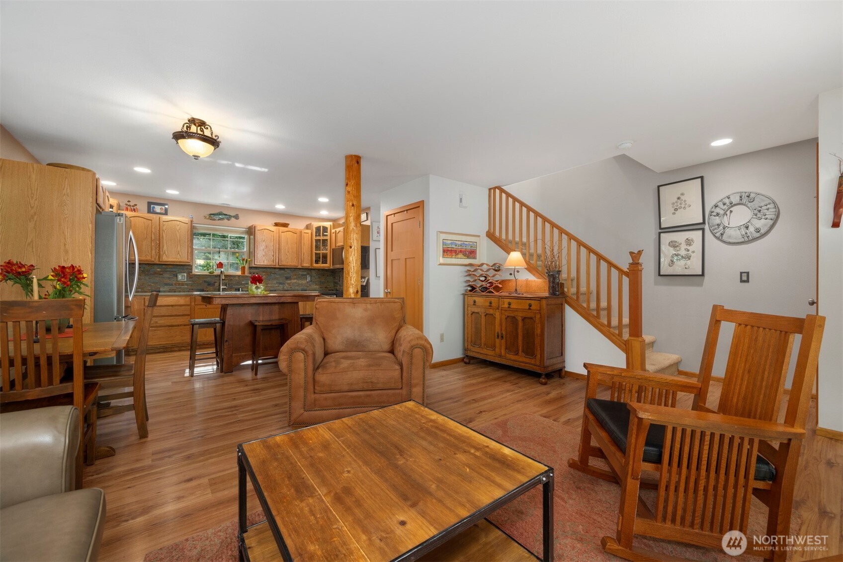337 Sudden Valley Drive Bellingham, WA 98229 - Photo 10 of 40 a living room with furniture kitchen view and a wooden floor