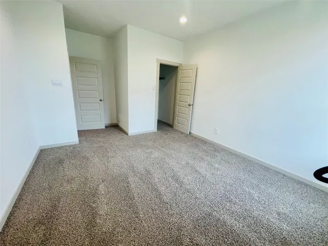 a view of an empty room and closet