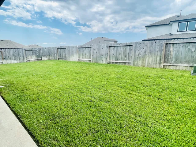 a view of a house with a big yard