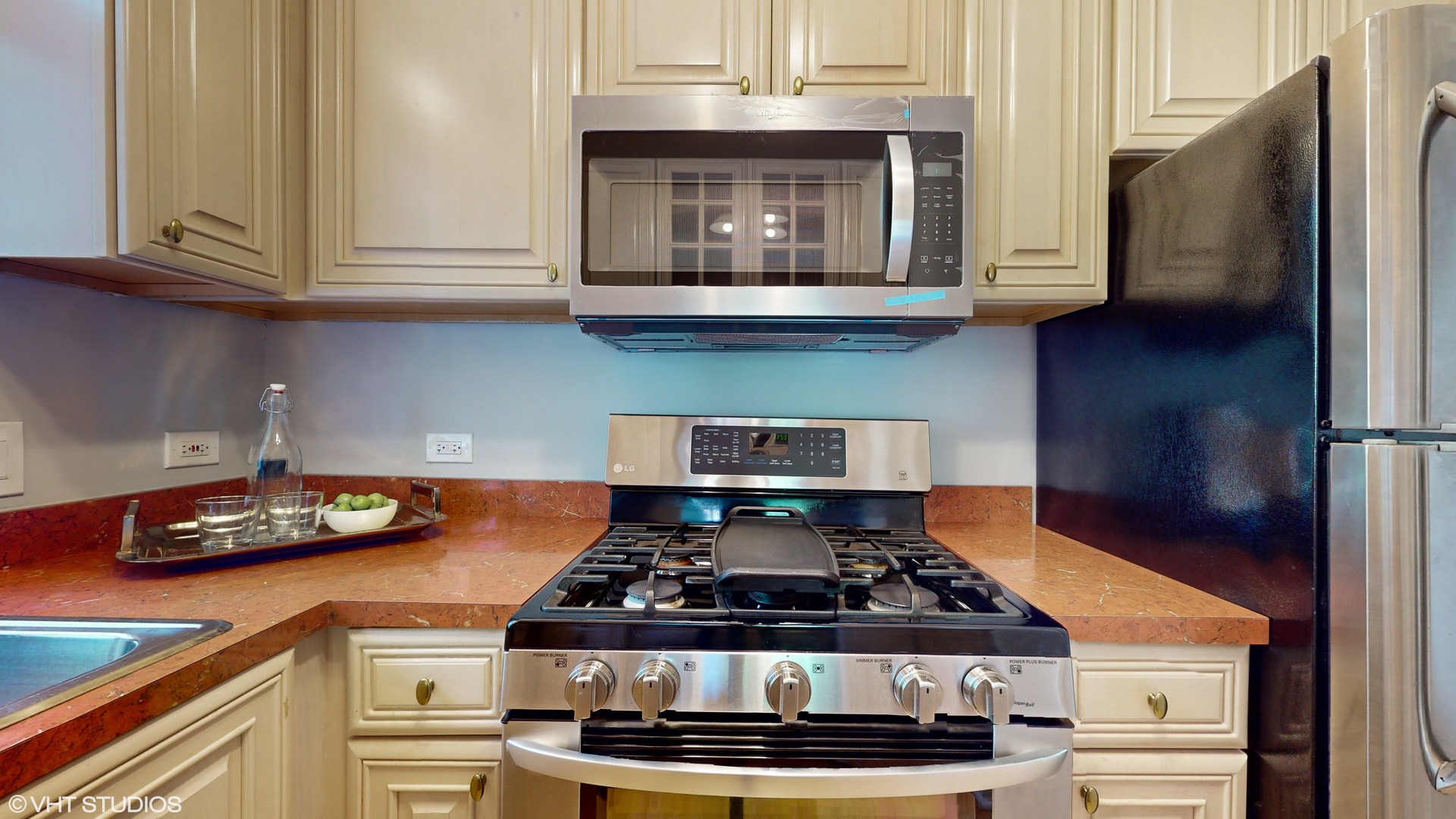 1401 West Fillmore Street, Unit 2 Chicago, IL 60607 - Photo 12 of 26 a stove top oven sitting inside of a kitchen