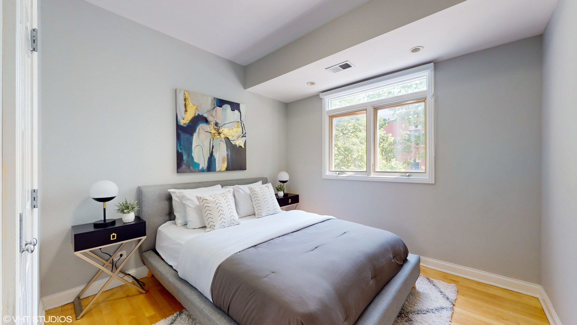 1401 West Fillmore Street, Unit 2 Chicago, IL 60607 - Photo 13 of 26 a bedroom with a bed and a window