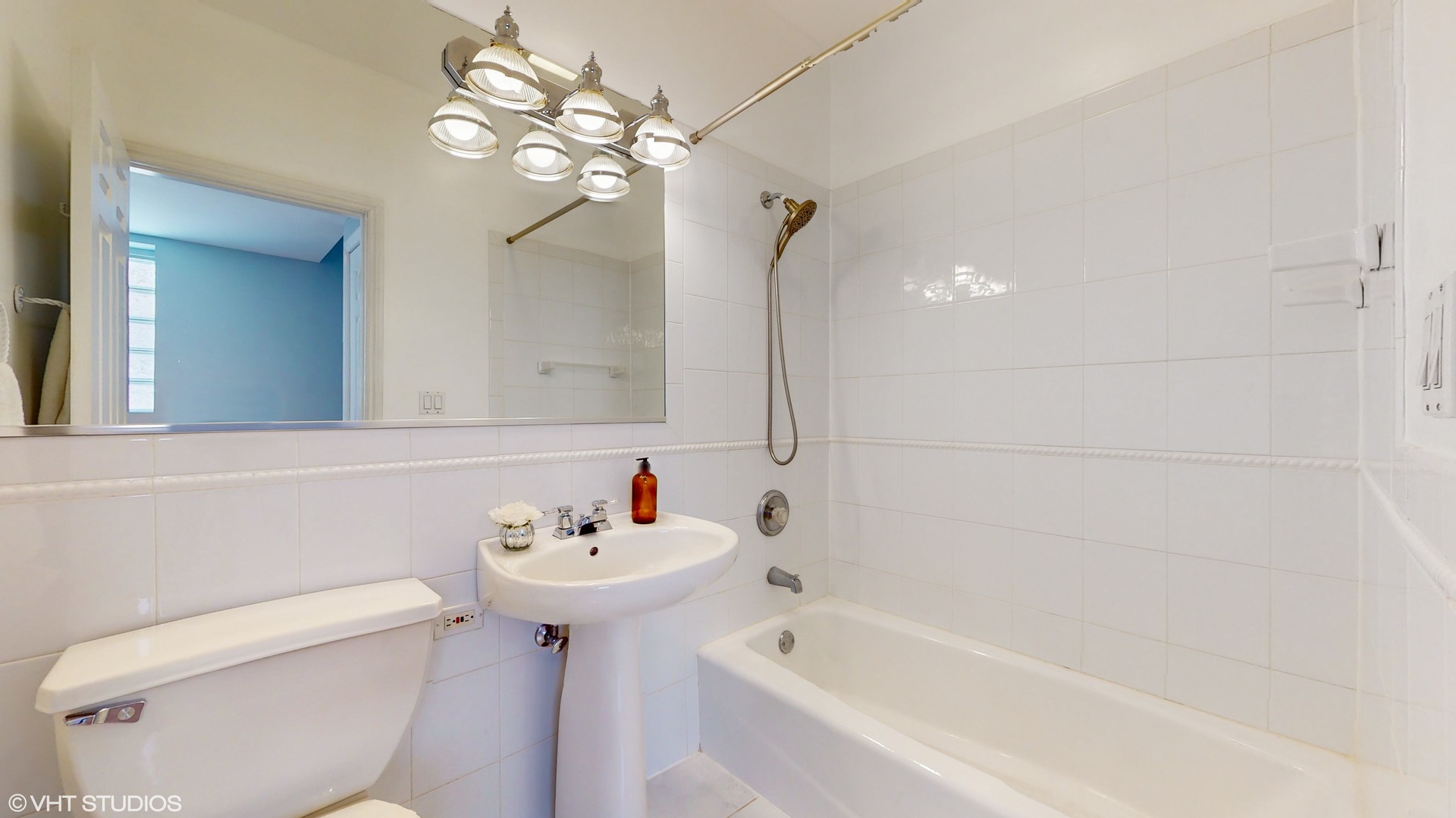 1401 West Fillmore Street, Unit 2 Chicago, IL 60607 - Photo 15 of 26 a bathroom with a sink a toilet and bathtub