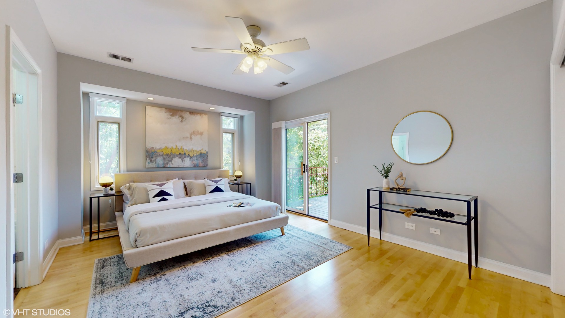 1401 West Fillmore Street, Unit 2 Chicago, IL 60607 - Photo 16 of 26 a spacious bedroom with a bed a window and a chandelier