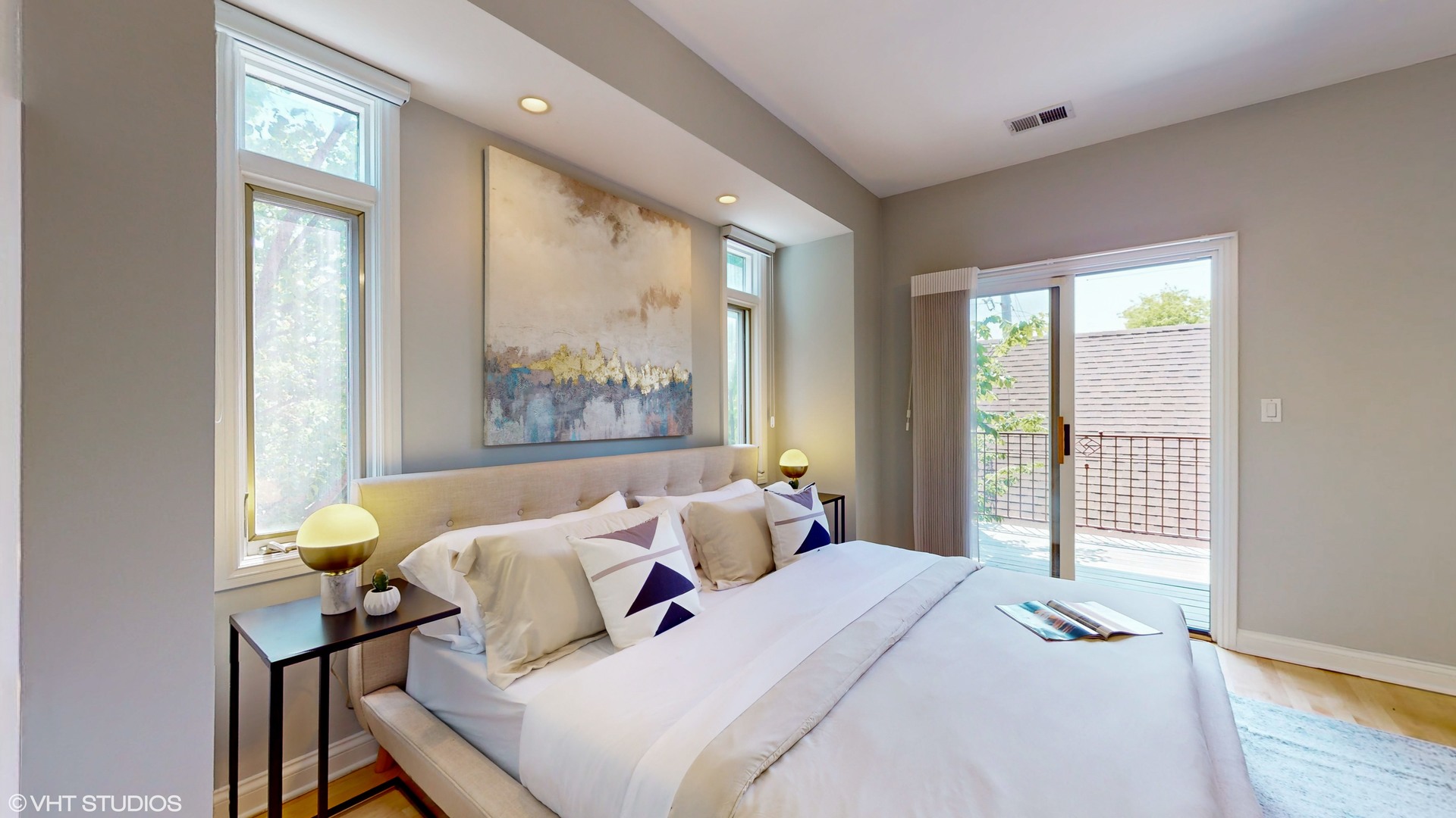 1401 West Fillmore Street, Unit 2 Chicago, IL 60607 - Photo 17 of 26 a bedroom with a bed and wooden floor