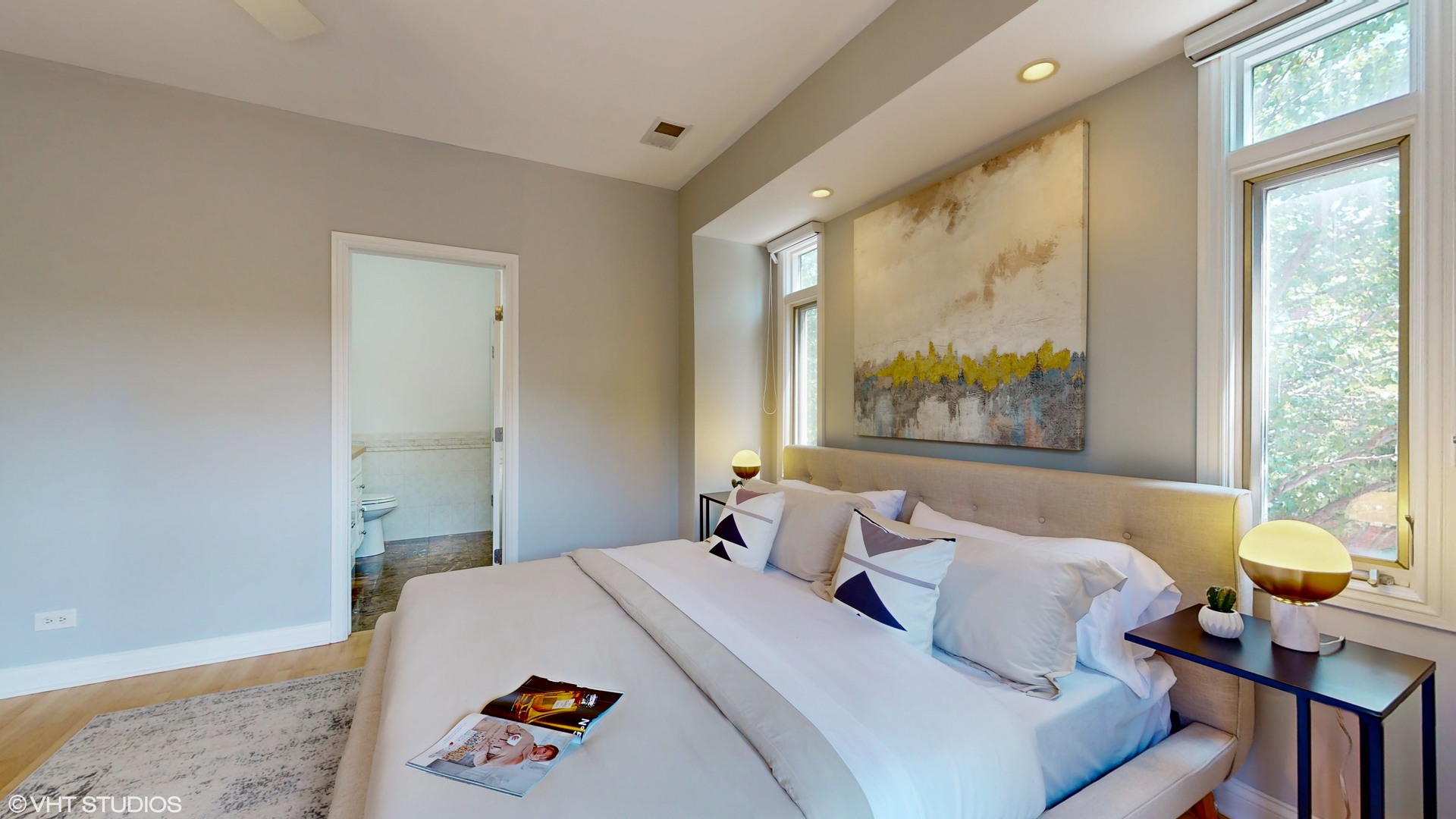 1401 West Fillmore Street, Unit 2 Chicago, IL 60607 - Photo 18 of 26 a bedroom with a bed and wooden floor