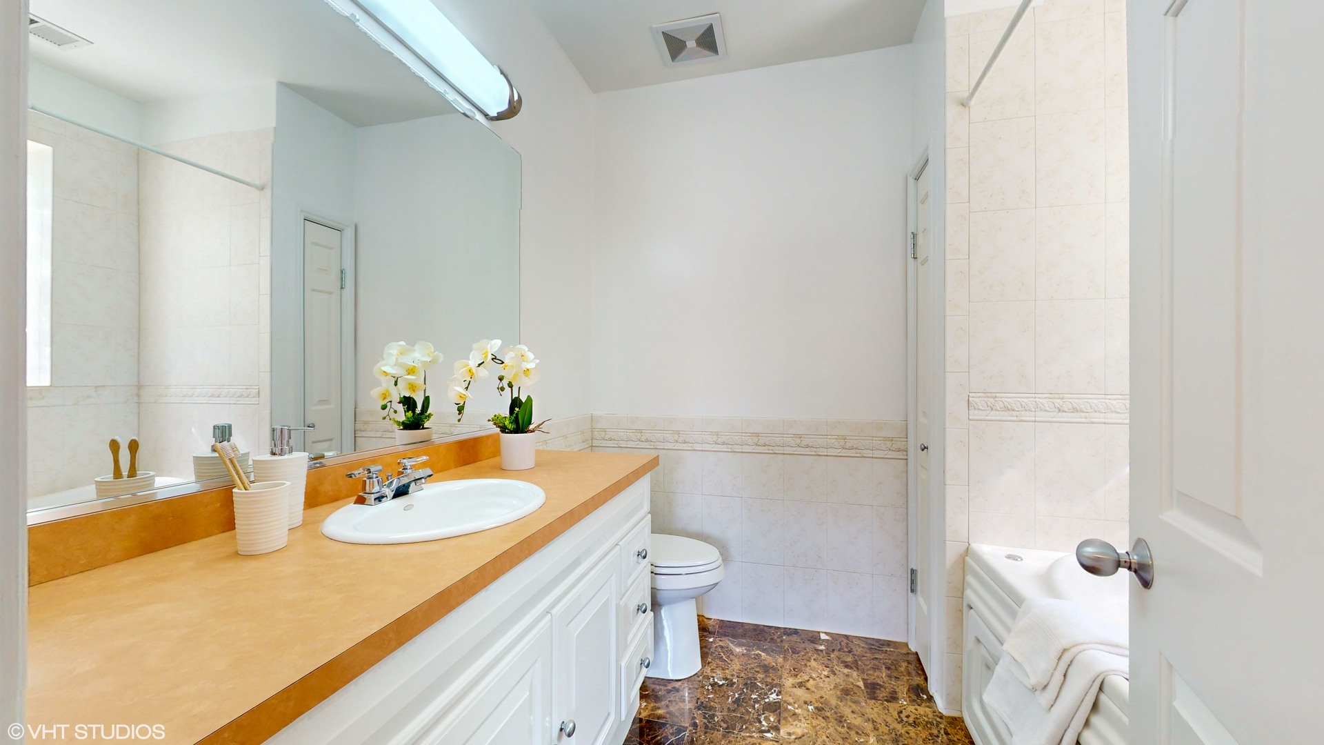 1401 West Fillmore Street, Unit 2 Chicago, IL 60607 - Photo 20 of 26 a bathroom with a sink toilet and shower