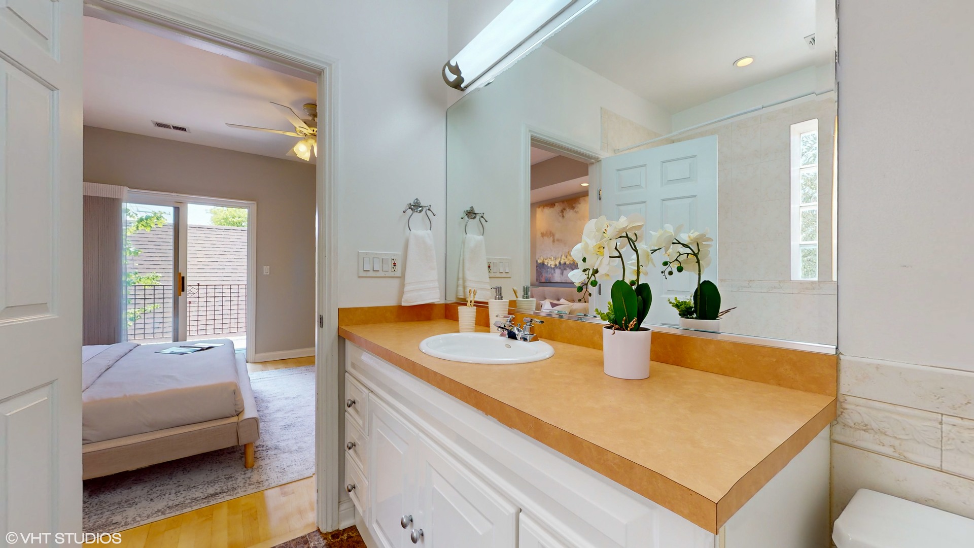 1401 West Fillmore Street, Unit 2 Chicago, IL 60607 - Photo 21 of 26 a bathroom with a sink a vanity and a mirror
