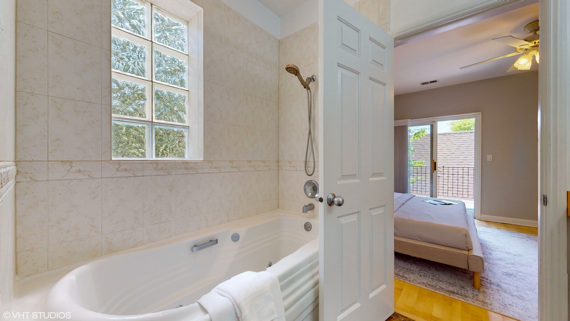 1401 West Fillmore Street, Unit 2 Chicago, IL 60607 - Photo 22 of 26 a bathroom with a tub shower and sink