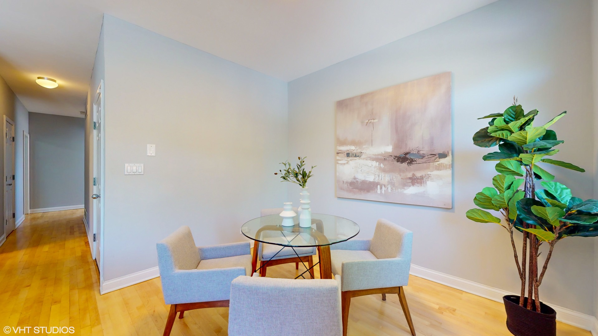 1401 West Fillmore Street, Unit 2 Chicago, IL 60607 - Photo 8 of 26 a view of a dining room with furniture and a potted plant