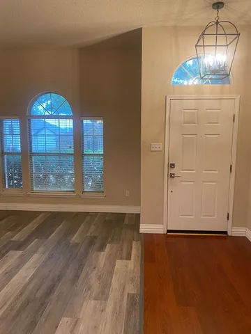 a view of a livingroom with wooden floor
