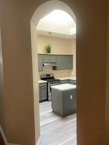 a kitchen with a sink and a stove