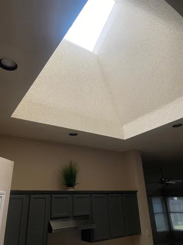 a kitchen with a sink and a stove top oven