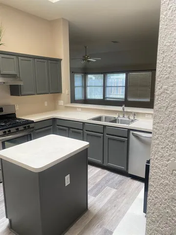 a room with a table and flat screen tv