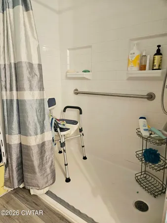 a bedroom with furniture and a window