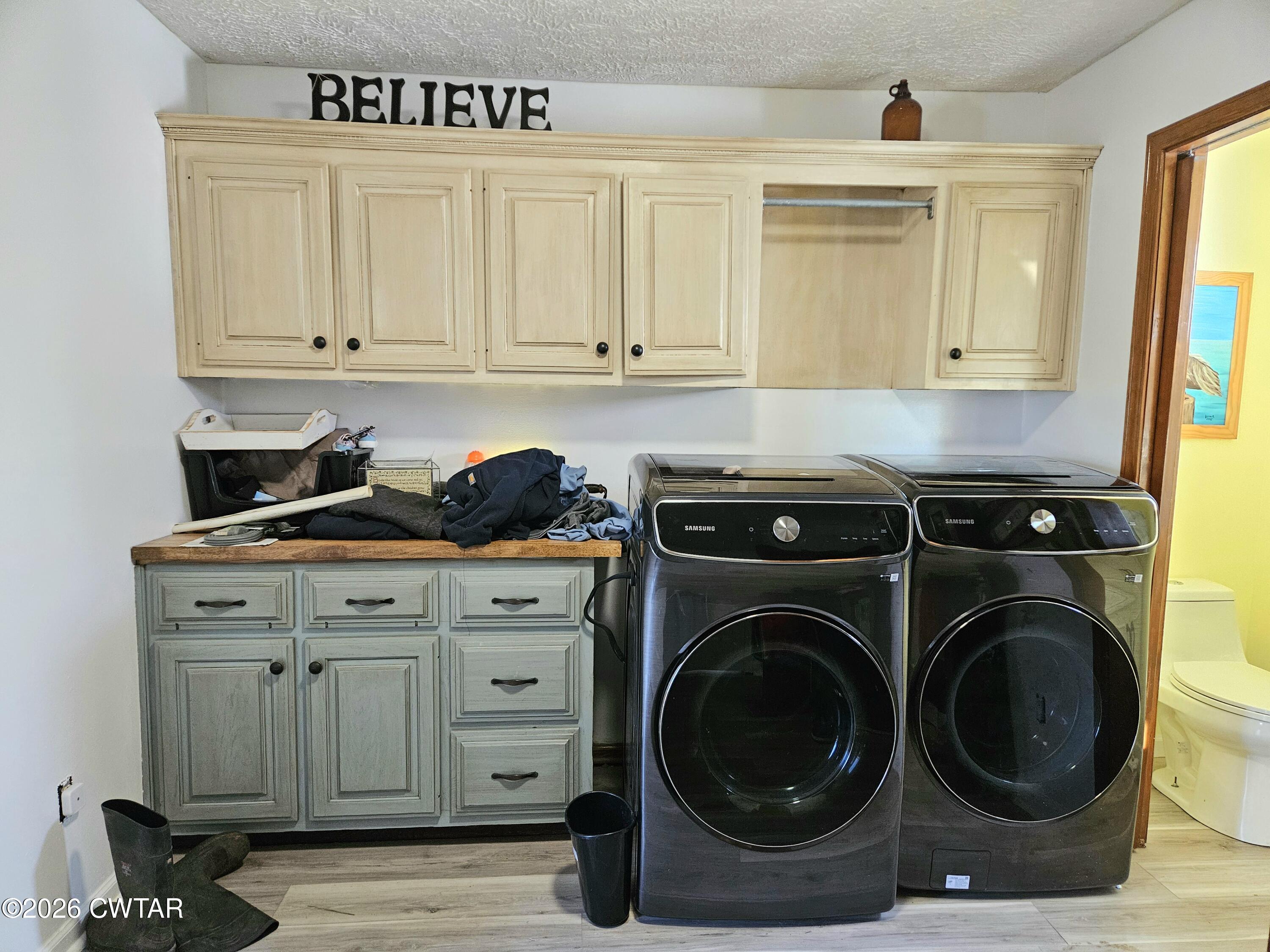 103 Spring Creek Law Road Jackson, TN 38305 - Photo 22 of 35 a utility room with sink dryer and washer