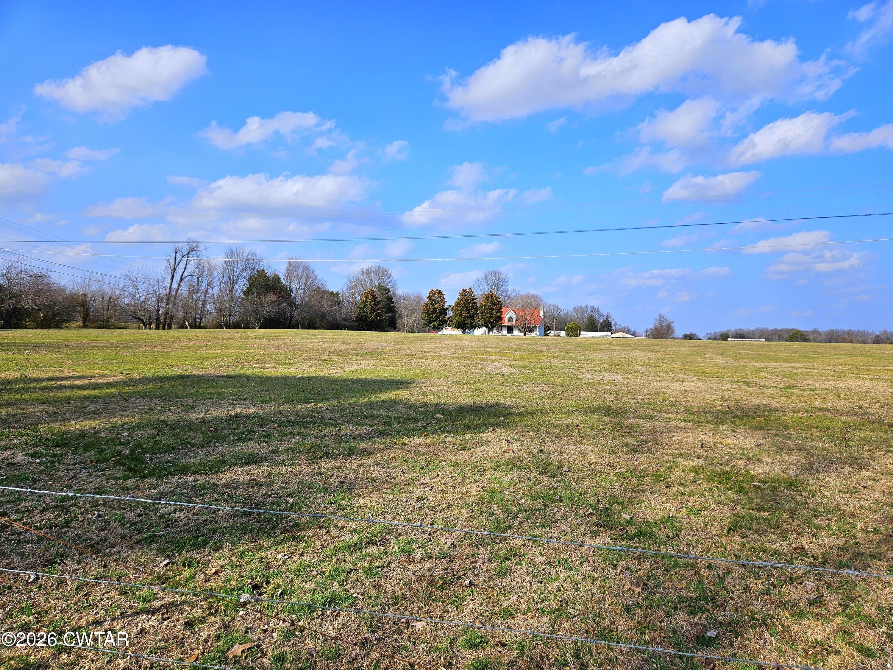 103 Spring Creek Law Road Jackson, TN 38305 - Photo 26 of 35 a view of a field with an ocean