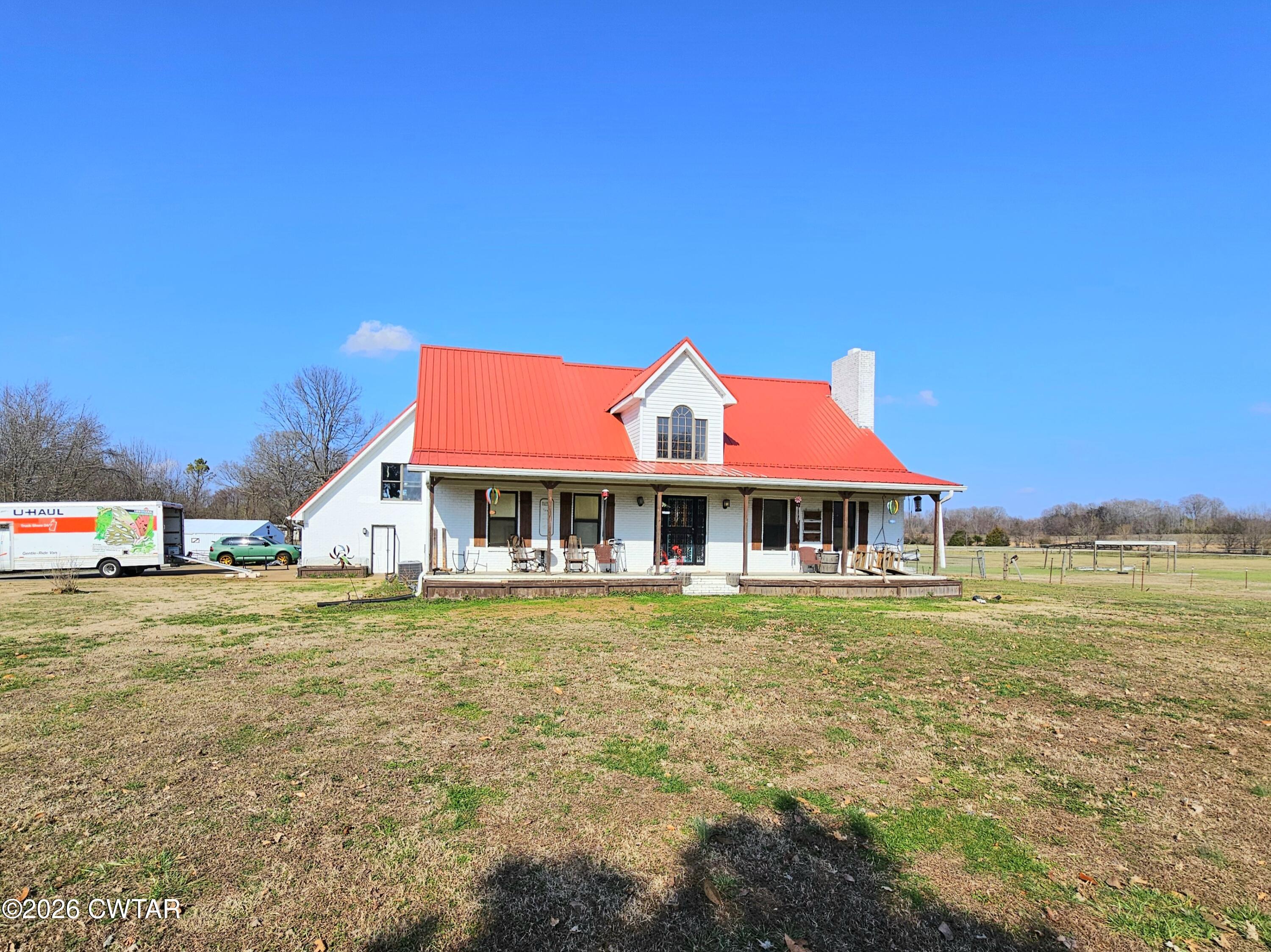 103 Spring Creek Law Road Jackson, TN 38305 - Photo 29 of 35 a front view of a house with a yard