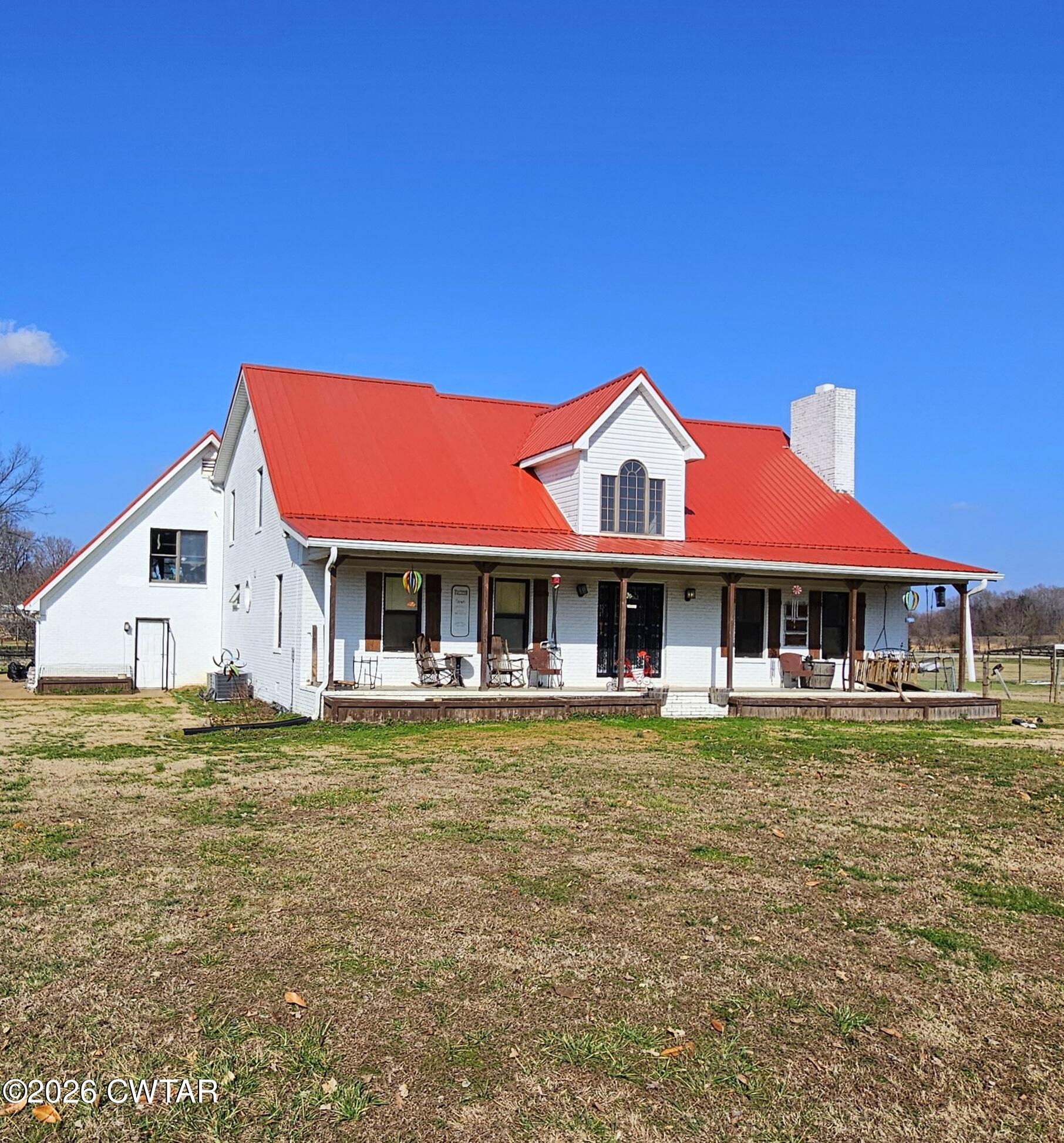 103 Spring Creek Law Road Jackson, TN 38305 - Photo 30 of 35 a front view of a house with swimming pool
