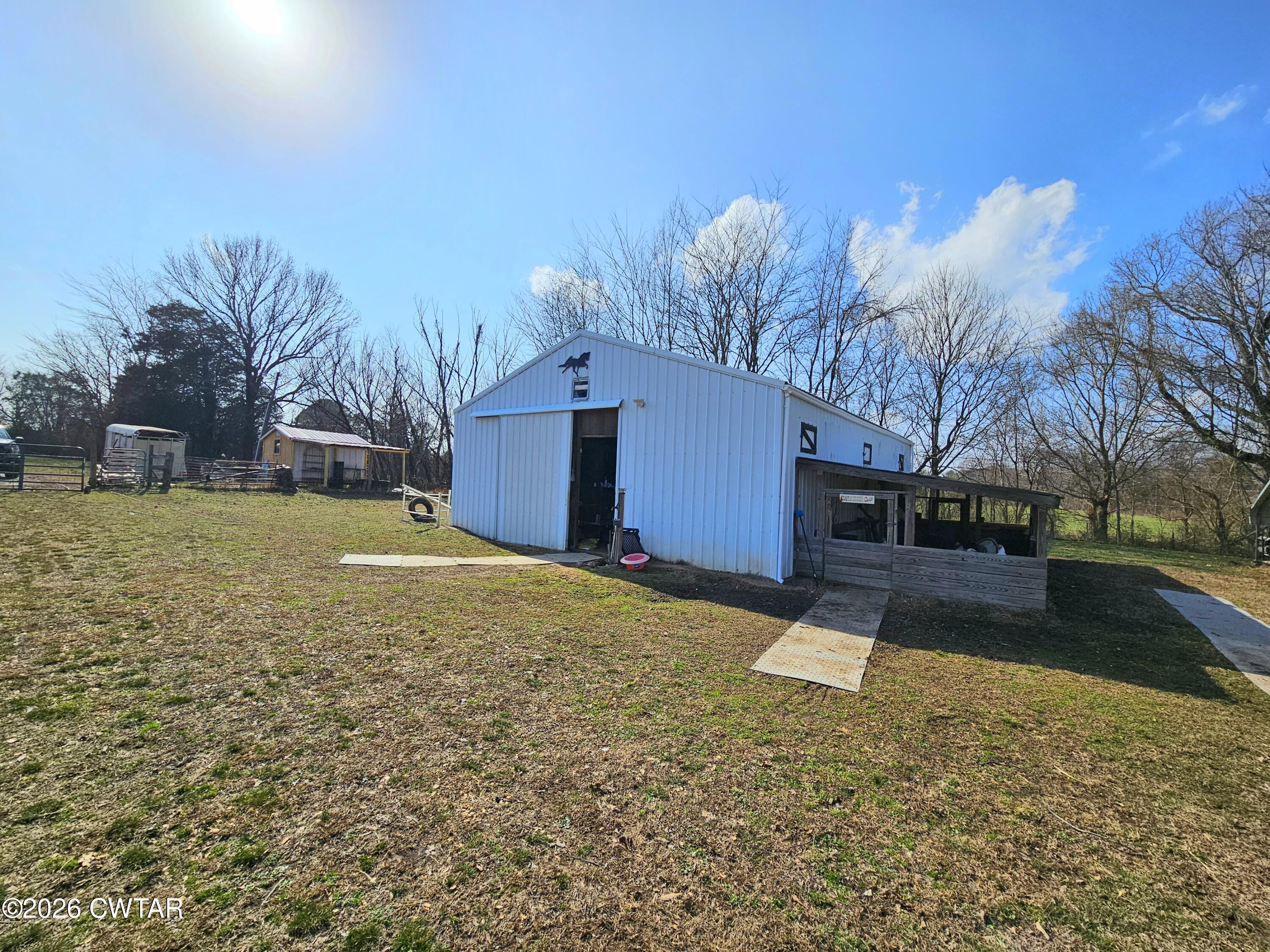 103 Spring Creek Law Road Jackson, TN 38305 - Photo 3 of 35 a view of a yard with a house