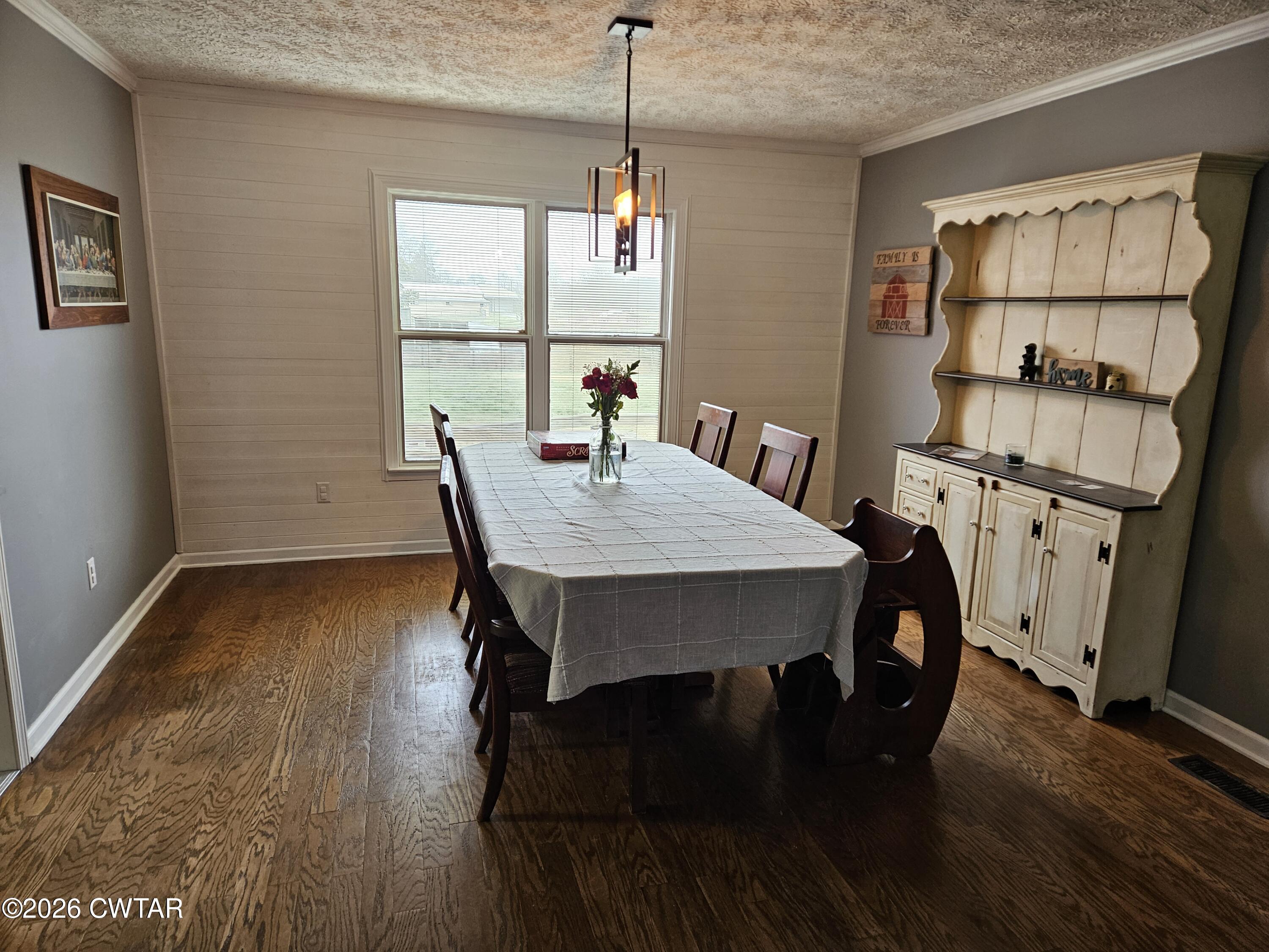 103 Spring Creek Law Road Jackson, TN 38305 - Photo 7 of 35 a view of a dining room with furniture window and wooden floor