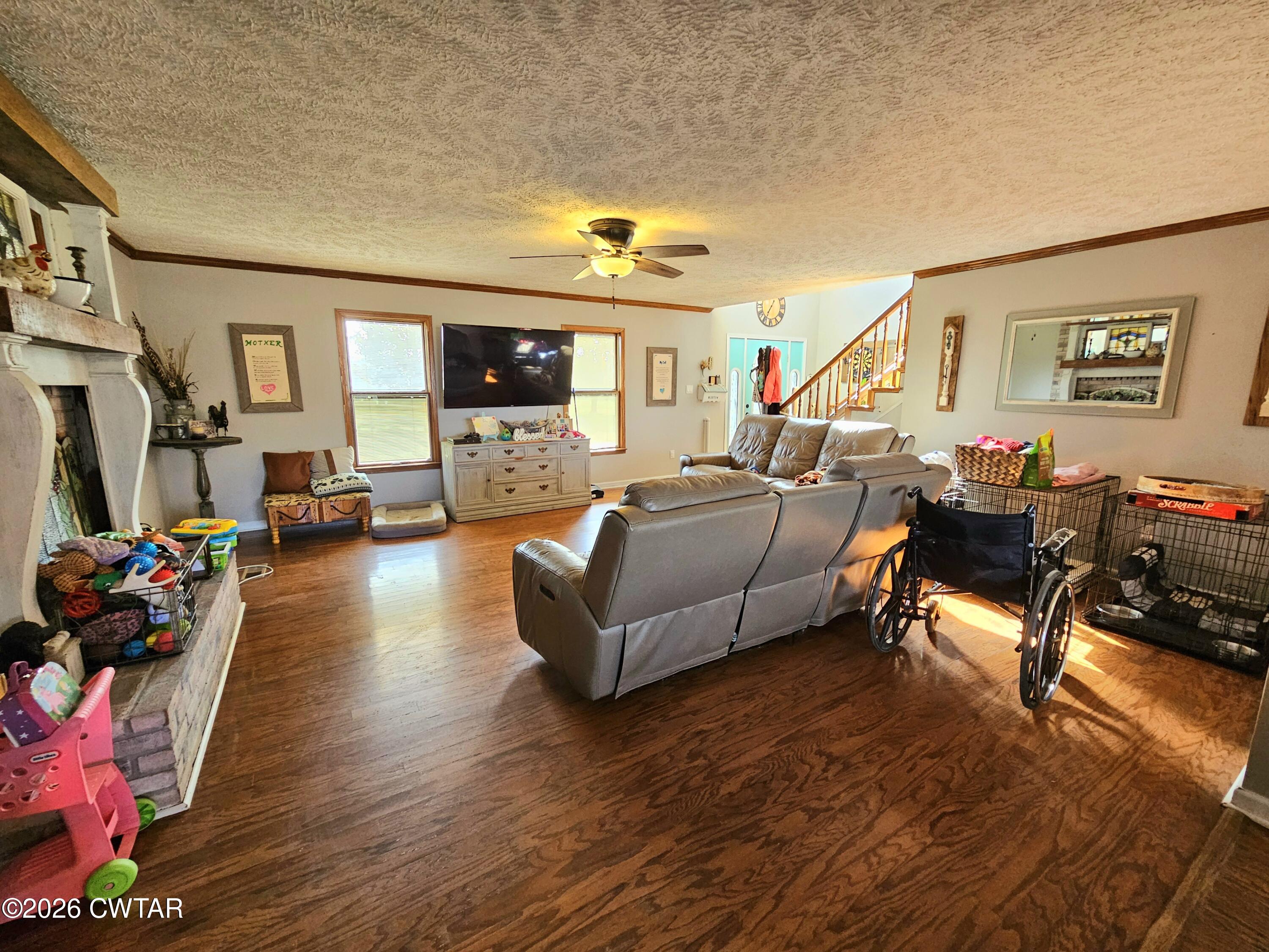 103 Spring Creek Law Road Jackson, TN 38305 - Photo 10 of 35 a living room with furniture and a wooden floor