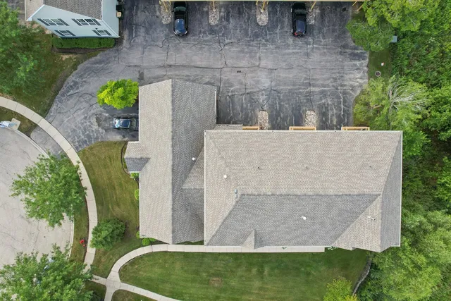 an aerial view of a house with outdoor swimming pool