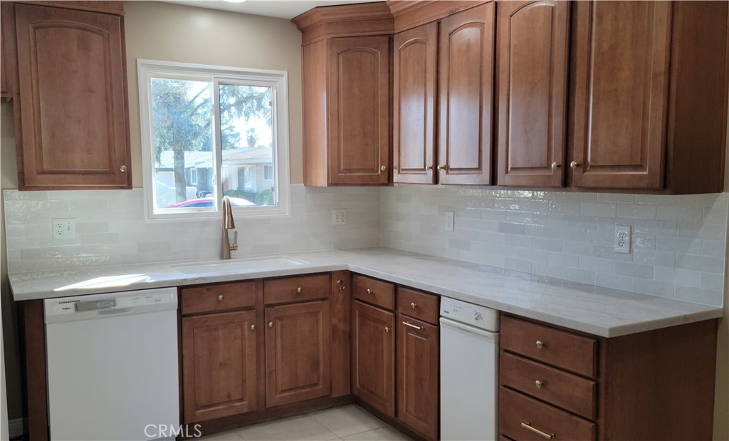 1309 Stillman Avenue Redlands, CA 92374 - Photo 4 of 23 a kitchen with a sink cabinets and window